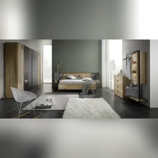 Thielemeyer Cubo Schlafzimmer mit Bett, Kleiderschrank und Kommode Thielemeyer Cubo Schlafzimmer mit Holzbett, Kleiderschrank und Kommode in einem Raum mit grüner Wand
